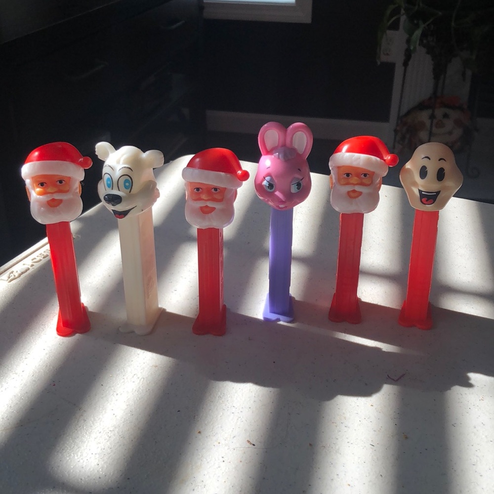7 PEZ dispensers three Santa’s